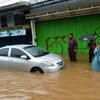 Cảnh ngập lụt sau mưa lớn tại Jakarta của Indonesia. (Ảnh: AFP/TTXVN)