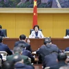 Phó Thủ tướng Trung Quốc Tôn Xuân Lan (giữa) chủ trì cuộc họp thảo luận giải pháp ngăn ngừa và kiểm soát COVID-19 tại Bắc Kinh ngày 20/1 vừa qua. (Ảnh: THX/TTXVN)
