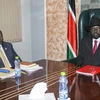 Tổng thống Nam Sudan Salva Kiir (phải) và thủ lĩnh phe đối lập Riek Machar (trái). (Ảnh: AFP/TTXVN)