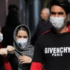 Người dân đeo khẩu trang phòng tránh dịch COVID-19 tại Tehran, Iran, ngày 23/2 vừa qua. (Ảnh: AFP/TTXVN)