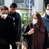 Người dân đeo khẩu trang phòng tránh dịch COVID-19 tại Tehran, Iran, ngày 22/2 vừa qua. (Ảnh:AFP/TTXVN)