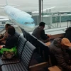 Hành khách tại phòng chờ ở sân bay quốc tế Incheon, phía tây Seoul, Hàn Quốc. (Ảnh: Yonhap/TTXVN)