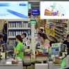 Người dân mua sắm tại một siêu thị ở Seoul, Hàn Quốc. (Ảnh: AFP/TTXVN)