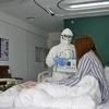 Bệnh nhân nhiễm COVID-19 điều trị tại bệnh viện ở Bắc Kinh, Trung Quốc. (Ảnh: THX/TTXVN)