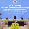 Thủ tướng Nguyễn Xuân Phúc và các Phó Thủ tướng chủ trì hội nghị tại điểm cầu Hà Nội. (Ảnh: Thống Nhất/TTXVN)