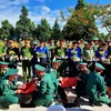 Lễ an táng 18 hài cốt liệt sỹ tại Nghĩa trang liệt sỹ huyện Cam Lộ. (Ảnh: Hồ Cầu/TTXVN)