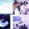 Việc tư vấn khám, chữa bệnh từ xa tại Bệnh viện Đại học Y Hà Nội và 3 bệnh viện vệ tinh được thực hiện trực tuyến dưới sự hỗ trợ của nền tảng công nghệ. (Ảnh: Thống Nhất/TTXVN)