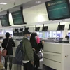 Công dân Việt Nam làm thủ tục lên máy bay tại sân bay quốc tế Sydney, ngày 7/8. (Ảnh: Nguyễn Minh/TTXVN)