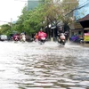 Tuyến đường Quang Trung, thành phố Quảng Ngãi ngập nặng. (Ảnh: Lê Ngọc Phước/TTXVN)
