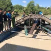 Các tàu khai thác cát trái phép của Công ty TNHH Long Hải Sơn Tây Ninh bị bắt quả tang. (Ảnh: Thanh Tân/TTXVN)