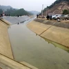Thông dòng chảy sau sự cố vỡ kênh Bắc sông Chu-Nam sông Mã đoạn chảy qua huyện miền núi Ngọc Lặc, tỉnh Thanh Hóa. (Ảnh: Nguyễn Nam/TTXVN)