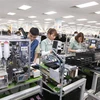 Công nhân Công ty Trách nhiệm hữu hạn Samsung Electronics Việt Nam Thái Nguyên. (Ảnh: Anh Tuấn/TTXVN)