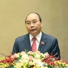 Thủ tướng Nguyễn Xuân Phúc trình bày báo cáo tổng kết của Chính phủ nhiệm kỳ 2016-2021, sáng 24/3. (Ảnh: Thống Nhất/TTXVN)