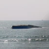 Tàu vận tải Bạch Đằng bị chìm trong vùng biển Mũi Né, tỉnh Bình Thuận. (Ảnh: Nguyễn Thanh/TTXVN)