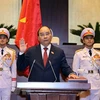 Chủ tịch nước Nguyễn Xuân Phúc tuyên thệ nhậm chức. (Ảnh: Thống Nhất/TTXVN)