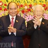 Tổng Bí thư Nguyễn Phú Trọng và Chủ tịch nước Nguyễn Xuân Phúc tại Lễ bàn giao. (Ảnh: Trí Dũng/TTXVN)