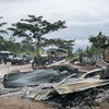 Hiện trường một vụ tấn công ở làng Manzalaho, gần Beni, CHDC Congo. (Ảnh: AFP/TTXVN)