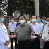 Đoàn công tác của Chính phủ do Thủ tướng Chính phủ Phạm Minh Chính dẫn đầu kiểm tra công tác phòng, chống dịch và điều trị bệnh nhân COVID-19 tại Bệnh viện Đa khoa tỉnh Bình Dương. (Ảnh: TTXVN phát)