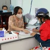 Các địa phương ở thành phố Phan Rang-Tháp Chàm giải quyết chi trả kinh phí cho người thuộc diện thụ hưởng theo Nghị quyết số 68/NQ-CP của Chính phủ. (Ảnh: Công Thử/TTXVN)
