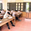 Các thi sinh tham dự kỳ thi tốt nghiệp trung học phổ thông đợt 2. (Ảnh: Hoàng Ngọc/TXVN)