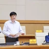 Bộ trưởng Bộ Y tế Nguyễn Thanh Long báo cáo công tác phòng, chống dịch. (Ảnh: Dương Giang/TTXVN)