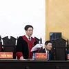 Thẩm phán, Chủ tọa Phiên tòa Nguyễn Xuân Văn tuyên án các bị cáo. (Ảnh: Phạm Kiên/TTXVN)