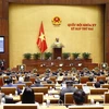 Quốc hội biểu quyết thông qua dự thảo Nghị quyết về phân bổ ngân sách trung ương năm 2022. (Ảnh: Doãn Tấn/TTXVN)
