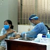 Người cao tuổi, người mắc bệnh nền tiêm mũi 3 tại phường Võ Thị Sáu, quận 3, TP Hồ Chí Minh. (Ảnh: Thanh Vũ/TTXVN)