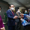 Đoàn đại biểu thực hiện các nghi thức Lễ dâng cúng bánh tét Quốc tổ Hùng Vương tại Khu tưởng niệm các Vua Hùng. (Nguồn: sggp.org)