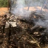 Hiện trường cháy nhà dân ở bản Pó Chà, xã Nậm Xe, huyện Phong Thổ, tỉnh Lai Châu, khiến một cháu nhỏ tử vong. (Ảnh: TTXVN phát)