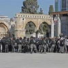Đụng độ giữa lực lượng an ninh Israel và người Palestine tại đền thờ Al Aqsa (còn được gọi là Núi Đền) ở Đông Jerusalem, ngày 15/4/2022. (Ảnh: AFP/TTXVN)