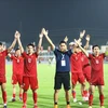 Các cầu thủ U23 Việt Nam ăn mừng sau chiến thắng. (Ảnh: Huy Hùng/TTXVN)