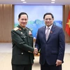 Thủ tướng Phạm Minh Chính tiếp Trung tướng Kham lieng Outhakai Sone, Tổng Tham mưu trưởng Quân đội nhân dân Lào. (Ảnh: Dương Giang/TTXVN)