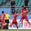 Các cầu thủ U23 Việt Nam vui mừng sau khi ghi bàn thắng vào lưới U23 Thái Lan. (Ảnh: TTXVN phát)