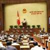 Quốc hội biểu quyết thông qua Nghị quyết về phê chuẩn quyết toán ngân sách Nhà nước năm 2020. (Ảnh: Doãn Tấn/TTXVN)