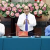 Chủ tịch nước Nguyễn Xuân Phúc tại buổi gặp mặt cán bộ, công nhân lao động tiêu biểu ngành Dầu khí. (Ảnh: Thống Nhất/TTXVN)