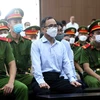 Hình ảnh Cựu Bí thư Tỉnh ủy Bình Dương Trần Văn Nam ra hầu tòa