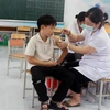 Tất cả trẻ từ 5 đến 17 tuổi trên địa bàn tỉnh Hà Nam tiêm vaccine phòng COVID-19 đảm bảo an toàn, đúng quy định. (Ảnh: Nguyễn Chinh/TTXVN)