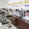Người dân đến thực hiện các thủ tục hành chính tại Trung tâm phục vụ hành chính công. (Ảnh: Nguyễn Thành/TTXVN)