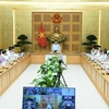 Phó Thủ tướng Thường trực Phạm Bình Minh chủ trì cuộc họp. (Ảnh: Minh Đức/TTXVN)