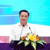 Phó Chủ tịch Thường trực UBND thành phố Cần Thơ Dương Tấn Hiển phát biểu tại diễn đàn. (Ảnh: Thanh Liêm/TTXVN)