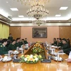 Thượng tướng Lê Huy Vịnh tiếp Chánh Văn phòng Bộ Quốc phòng Lào Saichay Kommasith. (Ảnh: Hồng Pha/TTXVN phát)