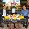 Bí thư Thành ủy Thành phố Hồ Chí Minh Nguyễn Văn Nên tiếp Phó Thủ tướng Lào Sonexay Siphandone. (Ảnh: Thanh Vũ/TTXVN)