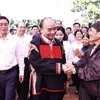 Chủ tịch nước Nguyễn Xuân Phúc thăm nhân dân Buôn Tring, thị xã Buôn Hồ, tỉnh Đắk Lắk. (Ảnh: Thống Nhất/TTXVN)
