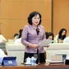 Thống đốc Ngân hàng Nhà nước Việt Nam Nguyễn Thị Hồng trình bày tờ trình. (Ảnh: Doãn Tấn/TTXVN)