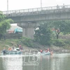 Đội cứu hộ cứu nạn 116 Thái Bình tìm thi thể nạn nhân. (Nguồn: Báo Thái Bình)