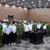 Thẩm phán, Chủ tọa phiên tòa Vũ Quang Huy tuyên án sơ thẩm đối với 54 bị cáo trong vụ án "Chuyến bay giải cứu." (Ảnh: Phạm Kiên/TTXVN)