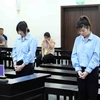 Hai bị cáo Nguyễn Thị An (phải) và Nguyễn Thị Lành tại phiên tòa xét xử. (Ảnh: Phạm Kiên/TTXVN)
