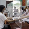 Ngân hàng Chính sách Xã hội tỉnh Bắc Giang giải ngân vốn vay ưu đãi theo Nghị quyết 11 của Chính phủ. (Ảnh: Đồng Thúy/TTXVN)