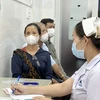 Người dân chờ khám đau mắt đỏ tại Bệnh viện Mắt Thành phố Hồ Chí Minh. (Ảnh: Đinh Hằng/TTXVN)